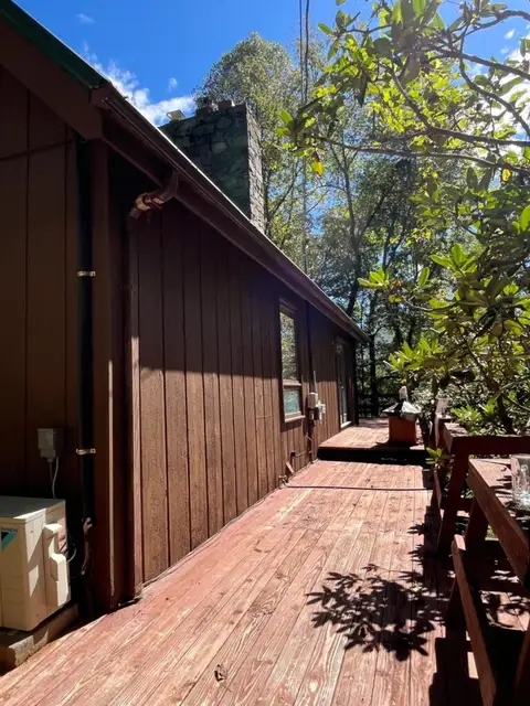 Fence Painting job in progress — Custom Painting of Asheville Inc